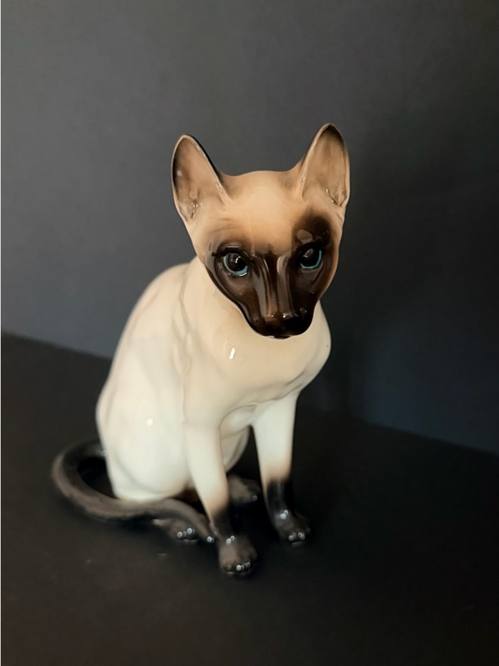 Vintage Shafford chocolate point Siamese cat ceramic figurine with blue eyes.